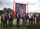 Members of LOL 783 Moneyrea with their old standard. Picture: News Letter archives