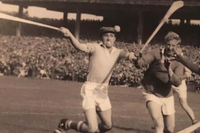 Eugene McMullan (left) playing hurling against Cork at Croke Park in the 1950s