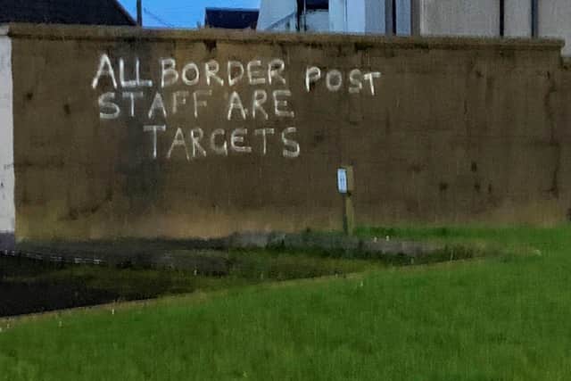 Graffiti daubed on a wall in the harbour area of Larne.