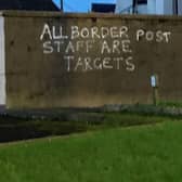 Graffiti daubed on a wall in the harbour area of Larne.