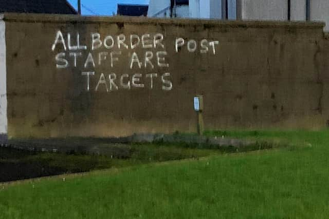 Graffiti daubed on a wall in the harbour area of Larne.