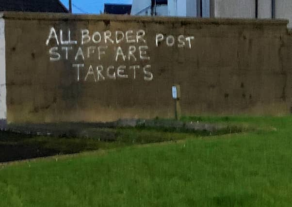 Graffiti daubed on a wall in the harbour area of Larne.