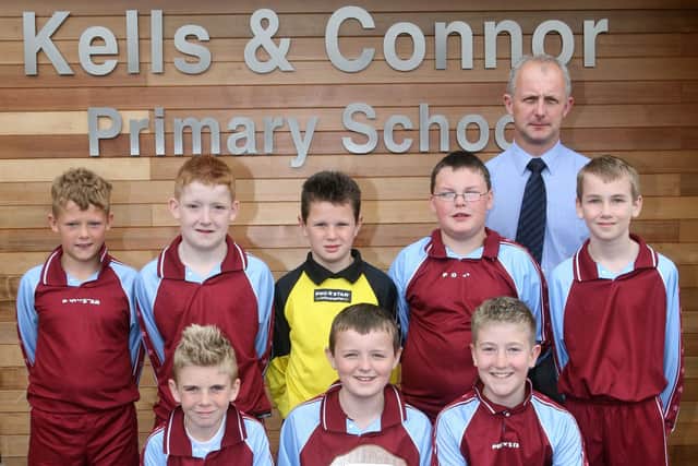 Members of the Kells and Connor PS football team who recently won the Ballymena and District Primary School 5 a side football competition. Included is Mr. R. McClelland. BT17-217AC