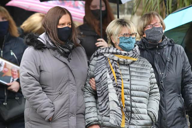 Roy Torrens' wife Joan (middle) pictured alongside her daughter Joanne (left) and her sister Ellen at yesterday's funeral, which took place in Portrush Presbyterian Church. Picture by Margaret McLaughlin