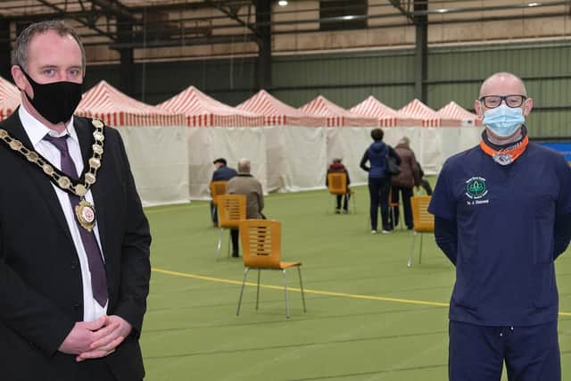 Chair of the Council, Councillor Cathal Mallaghan meets Dr John Diamond from Garden Street Surgery and Bellaghy Medical Centre at the GP-led COVID-19 vaccination clinic at Meadowbank Sports Arena in Magherafelt.