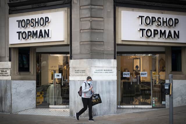 Topshop Topman store on Princes Street, Edinburgh. Asos has confirmed it has sealed the takeover of Topshop and three other brands from the collapse of the Arcadia retail empire for £265 million. The online fashion retailer is buying Topshop, Topman, Miss Selfridge and HIIT. Issue date: Tuesday December 1, 2020. PA Photo. See PA story CITY Arcadia. Photo credit should read: Jane Barlow/PA Wire