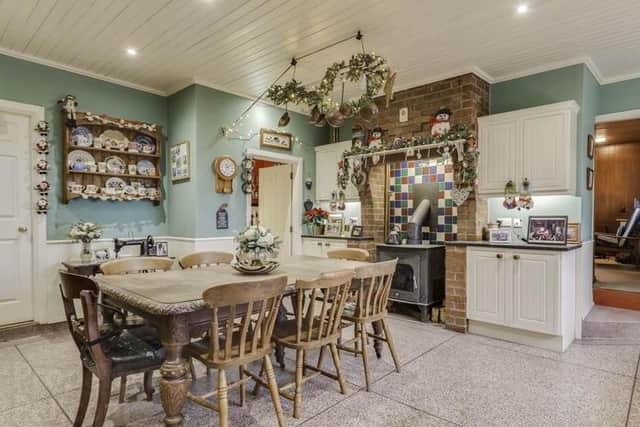The house has a kitchen with casual dining, as well as a separate utility room and pantry