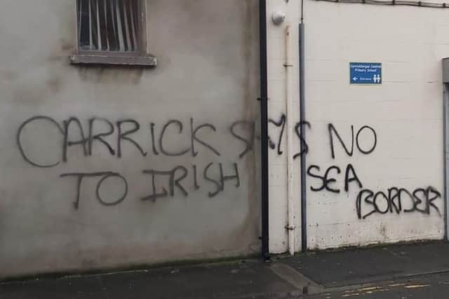 Graffiti daubed on premises in Unity Street, Carrickfergus.