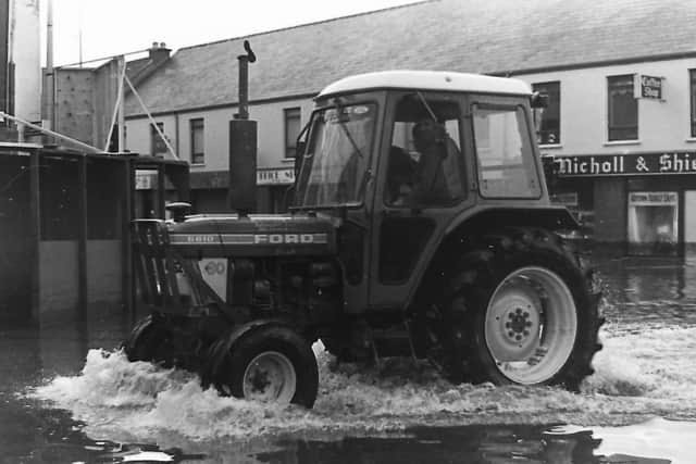 Farmers were called in to help after flooding swept through the Campsie area of Omagh, Co Tyrone in October 1987. Picture: News Letter archives