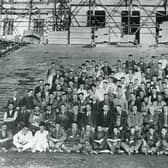 Some of those involved in the construction of Parliament Buildings at Stormont, Belfast. Does anyone recognise anyone in this old photo? Did anyone in your family help build Stormont? Get in touch, email: darryl.armitage@jpimedia.co.uk. Picture: News Letter archives