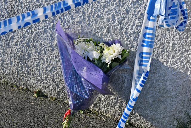 Flowers that were left by sympathisers at the scene of what the PSNI have described as a œsuspicious death  at a house at Carrickdale Gardens off the Tandragee Road in Portadown, County Armagh.
The woman, in her late twenties, who has died has been named locally as Kerrie King who came originally from Scotland. Photo by Alan Lewis.