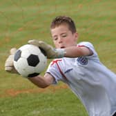 Another fine save from young Curtis Ross during the penalty kick competition at the Ebrington Primary School Summer Fete on Thursday. LS26-159KM