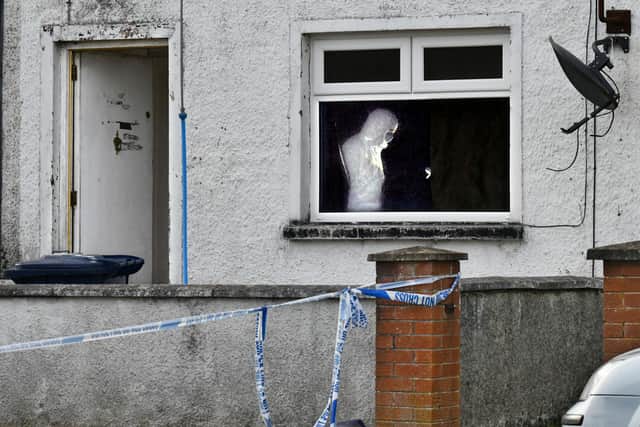 Flowers left at the front of the house where, inside, a police forensics officers was investigating the scene of what the PSNI have described as a â€œsuspicious deathâ€ at a house at Carrickdale Gardens off the Tandragee Road in Portadown, County Armagh. Alan Lewis - PhotopressBelfast.co.uk        10-2-2021