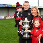 Banbridge Town manager Stuart King, who has a chance of winning £1 million celebrates winning the 2018 Bob Radcliffe Cup with his wife Bernice, son Charlie and daughter Lucy. Picture by Alan Weir/Pacemaker Press