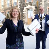 Mayor of Antrim and Newtownabbey, Councillor Jim Montgomery presents Dr Catherine Scully, Principal of Jordanstown School with a number of iPads aimed at addressing digital poverty in local communities.