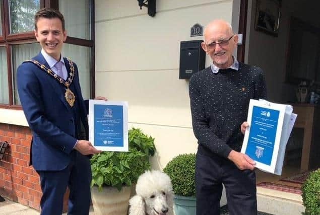 Mayor of Mid and East Antrim Cllr Peter Johnston, Abe and Bobby the dog