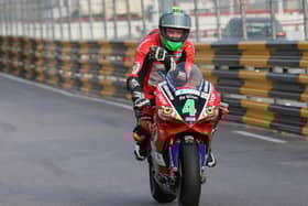 A visibly upset Glenn Irwin tours into pit lane at the 2017 Macau Grand Prix following a fatal accident that claimed the life of English rider Dan Hegarty.