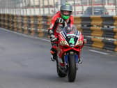A visibly upset Glenn Irwin tours into pit lane at the 2017 Macau Grand Prix following a fatal accident that claimed the life of English rider Dan Hegarty.