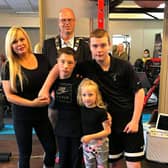Leanne pictured with her children and the Mayor of Antrim and Newtownabbey, Cllr Jim Montgomery, at an open day at the gym in 2020.