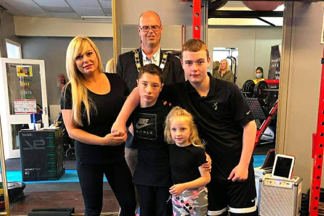 Leanne pictured with her children and the Mayor of Antrim and Newtownabbey, Cllr Jim Montgomery, at an open day at the gym in 2020.