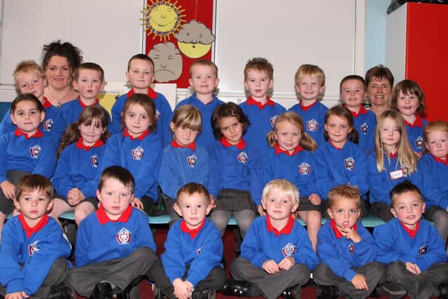 Miss Millar’s P1 Class at Ballymena Primary School with their teacher and Classroom Assistant Gayle Bamber. BT39-102JC