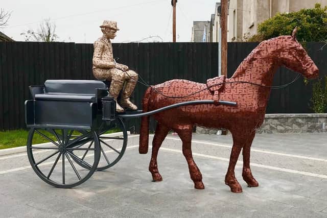 The 'Jaunting Car' sculpture in Larne was created by renowned artist Kevin Killen following consultation with local people.