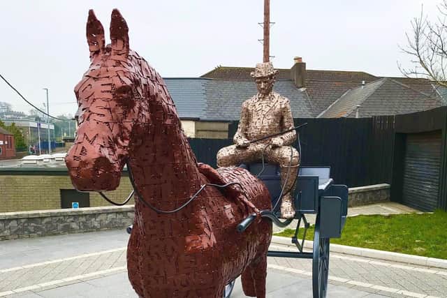 The sculpture recognises early pioneers of Larne's tourism industry.