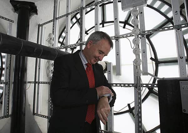 Peter McKay of Belfast City Council checks his watch inside the Albert Clock, Belfast. Picture: Gavan Caldwell/News Letter archives
