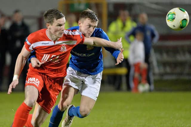 James Singleton (right) on his Mid-Ulster derby debut against Portadown in 2013 at Shamrock Park. Pic by PressEye Ltd.