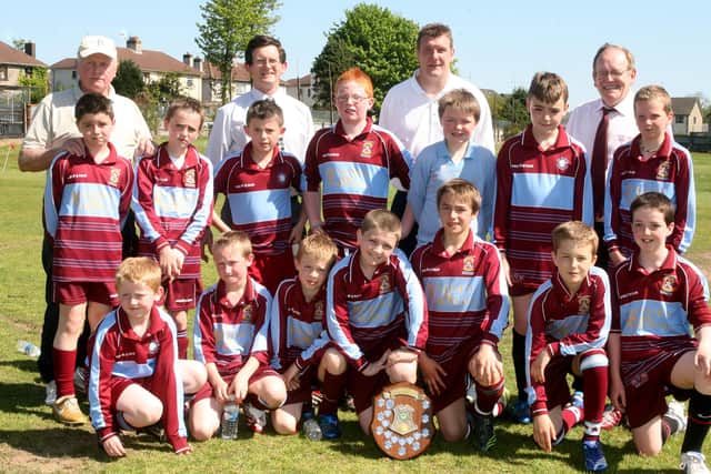 The St. Louis PS football team who finished runner up in the Ballymena and District Primary Schools Football Association senior cup. Included are Jerry Sexton (coach), Martin Kearney (Principal St. Marys PS), Tommy Wright (Ballymena United manager) and Liam Corey (St. Louis PS Principal). BT19-214AC
