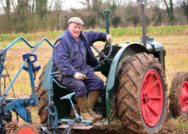 William Steenson from Markethill, Co Armagh, with his 1943 Fordson tractor at the 99th Mullahead Ploughing Match in February 2014. Picture: Gavan Caldwell/News Letter archives