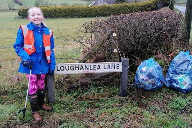 A young volunteer with Larne Eco Rangers.