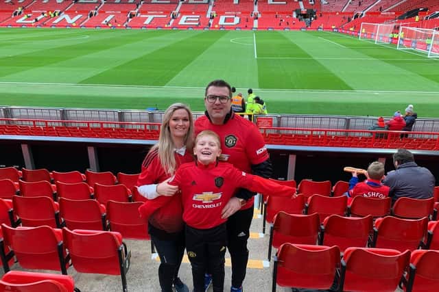 Ben with his mum Claire and dad Andrew at the home of Manchester United