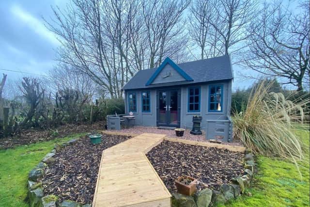 There are a range of outbuildings including a Summer House with Bar area.