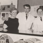 Behind the reception desk in the King's Arms Hotel in 1967-68.   Anna ? (receptionist),  John Bell, waiter / porter,  Frank Cosgrove (?) and  restaurant waitress Sinead.
Gareth Jones recalls that Sinead knitted superb Aran jumpers and cardigans. 
"My father had his for many, many years. He used it when he was working in the cellar of our pub in Wales and said it was like wearing a blanket. He wore it for so many years and was heartbroken when it eventually wore out!" said Gareth.