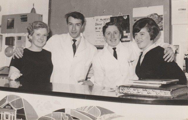 Behind the reception desk in the King's Arms Hotel in 1967-68. Anna ? (receptionist), John Bell, waiter / porter, Frank Cosgrove (?) and restaurant waitress Sinead.
Gareth Jones recalls that Sinead knitted superb Aran jumpers and cardigans.
"My father had his for many, many years. He used it when he was working in the cellar of our pub in Wales and said it was like wearing a blanket. He wore it for so many years and was heartbroken when it eventually wore out!" said Gareth.