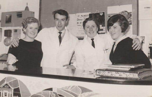 Behind the reception desk in the King's Arms Hotel in 1967-68.   Anna ? (receptionist),  John Bell, waiter / porter,  Frank Cosgrove (?) and  restaurant waitress Sinead.Gareth Jones recalls that Sinead knitted superb Aran jumpers and cardigans. "My father had his for many, many years. He used it when he was working in the cellar of our pub in Wales and said it was like wearing a blanket. He wore it for so many years and was heartbroken when it eventually wore out!" said Gareth.