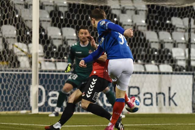 Joel Cooper scores for Linfield before team-mate Shayne Lavery secured the 2-1 victory over Crusaders. Pic by Pacemaker.