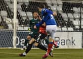 Joel Cooper scores for Linfield before team-mate Shayne Lavery secured the 2-1 victory over Crusaders. Pic by Pacemaker.