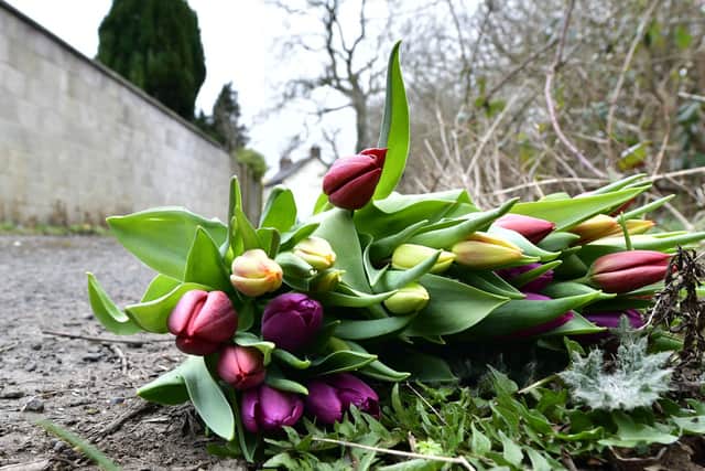 Flowers left at the scene  on Glenville Road, Newtownabbey. 
Pic Colm Lenaghan/Pacemaker