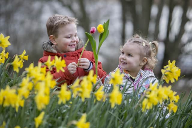 Finn Hamilton and Molly-Rose Cassidy help to celebrate the season of spring ahead of this year’s virtual Ballymoney Spring Fair which features a series of short videos showcasing the town and its surrounding areas. Please note, this photograph was taken prior to current public health restrictions