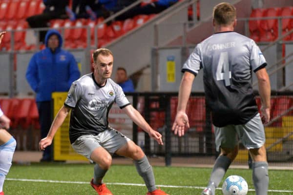 Defender Conor Quigley in action against Strabane Athletic, in one of the few games he played for Institute last year.