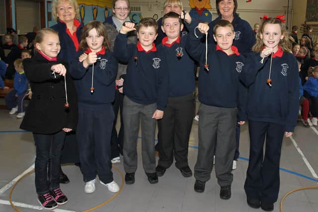 Harryville Primary School pupils who reached the final stages of the school's annual Conkers competition are seen here with staff members Mrs Hall, Mrs Millar, Mrs Kernohan and Mrs Alexander who officiated at the big event. Pupils included are Samantha, Rebecca, jack, Luke Norman and Celine. BT44-100JC