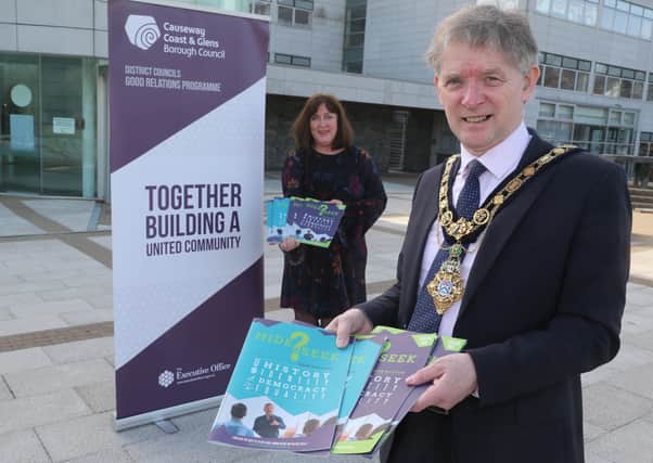 The Mayor of Causeway Coast and Glens Borough Council Alderman Mark Fielding pictured at Cloonavin with Good Relations Officer Joy Wisener to mark the launch of the new ‘Hide or Seek?’ resource which is now available for post-primary schools