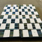 The paperwork required to buy four pallets of jam, marmalade and chutney from England, laid out on top of the four pallets