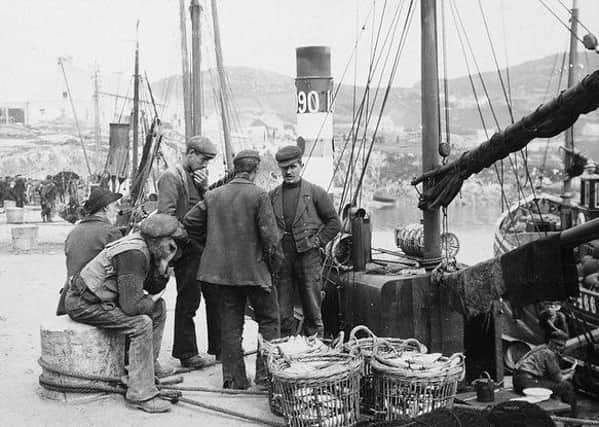Fishermen on the pier at Downings, Co Donegal. Circa 1910 (but definitely between circa 1906 and 1914). NLI Ref.: CDB51. Picture: National Library of Ireland