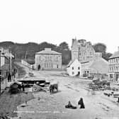 This is beautiful old photograph of the Market Square in Dungannon, Co Tyrone from the archives of the National Library of Ireland. It shows traders set up in anticipation of sales to the people who must surely come to the market. Catalogue range circa 1865-1914. Definitely after 1871 (tower). And before 1891 (post office) Likely circa1800 (businesses). NLI Ref: L_CAB_02160. Picture: National Library of Ireland