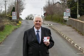 Cookstown 100 race secretary Norman Crooks with his British Empire Medal on the Cookstown 100 course in Co Tyrone. Picture: Baylon McCaughey.
