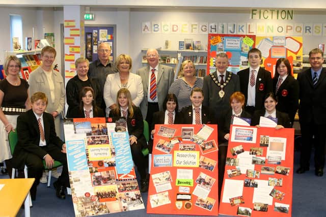 Students from Ballee High School with some of their work from the Civic-Link programme. Included is Mayor of Ballymena, Cllr. Maurice Mills, staff and members of the Board of Governors. BT26-213AC