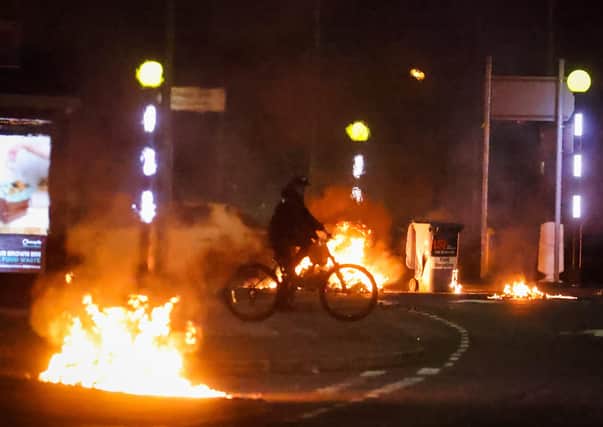 Cars burning at the Doagh Road roundabout of Newtownabbey in County Antrim on Saturday night. 

Photo by Kelvin Boyes / Press Eye.
